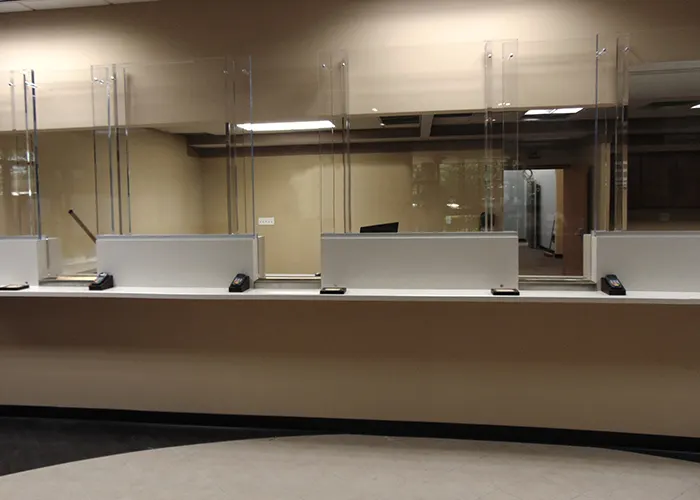 Bullet resistant glass installation for a secure facility